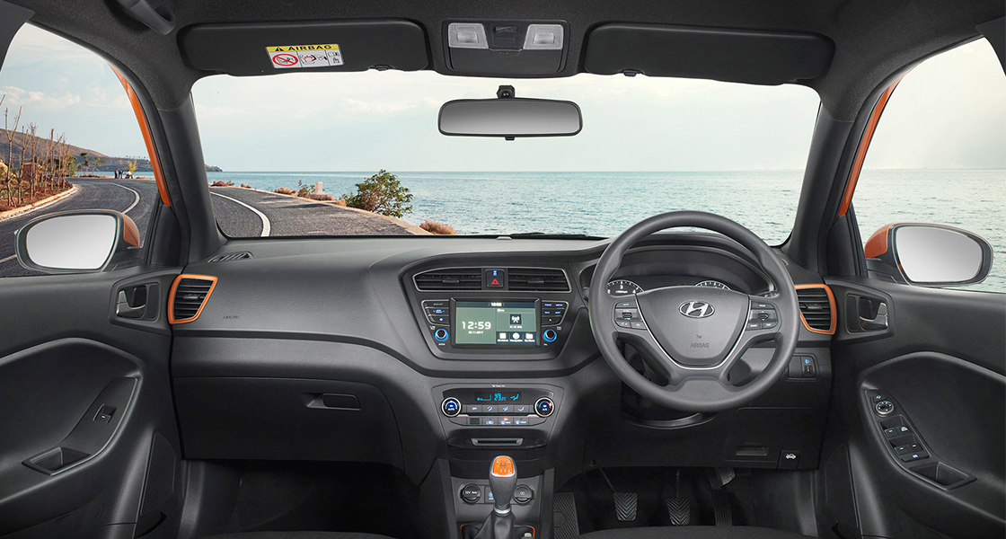 Panoramic view of front seats black and beige color interior