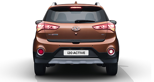 Side rear view of red i10 parked outdoor