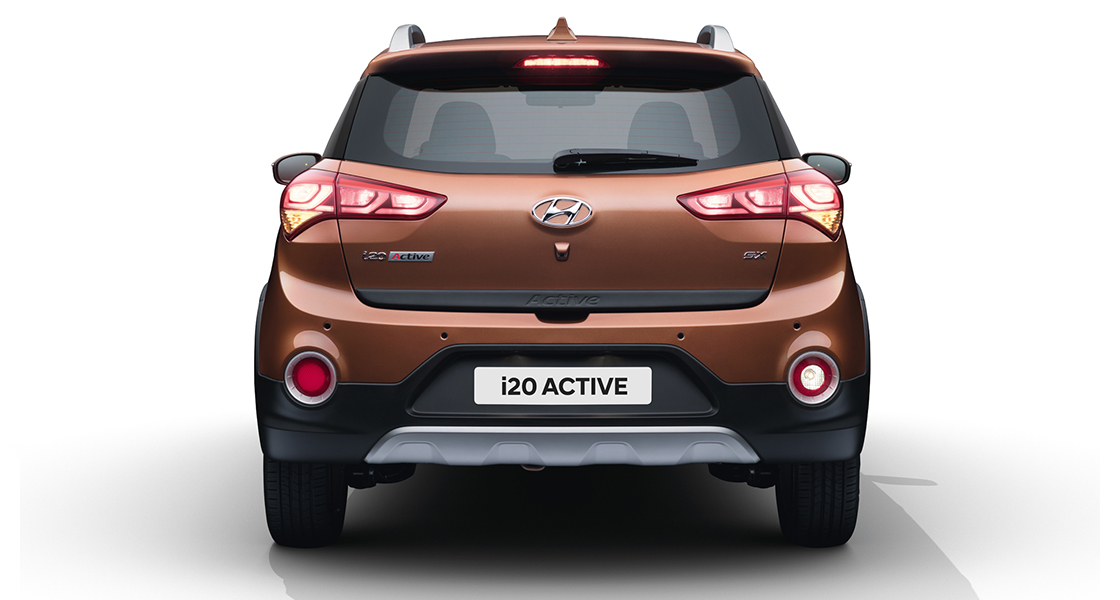 Side rear view of red i10 parked outdoor