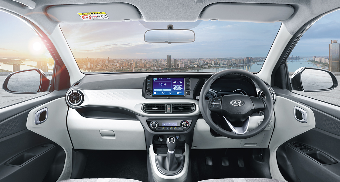 Left side front view of orange Grandi10