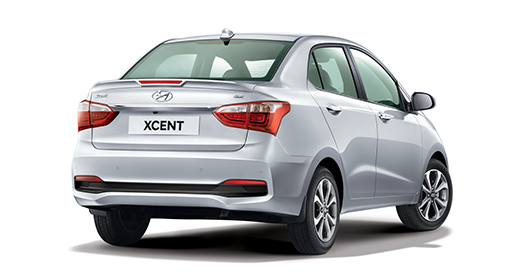 Right side rear view of silver Xcent