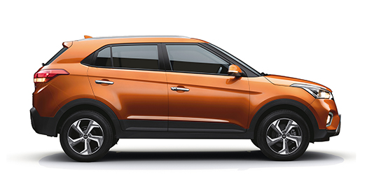 Right side-front view of white creta parked in front of the building