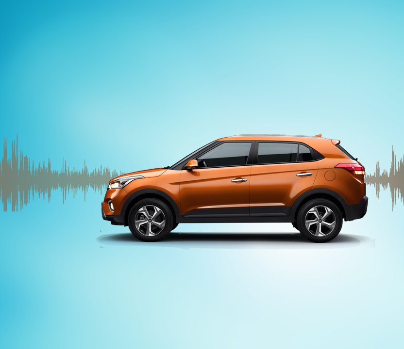 Side view of silver Creta with sound wave graphic on the background